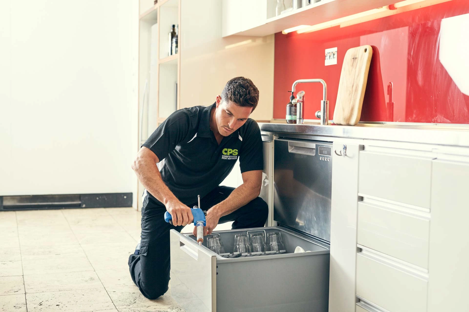 Residential pest control technician at work