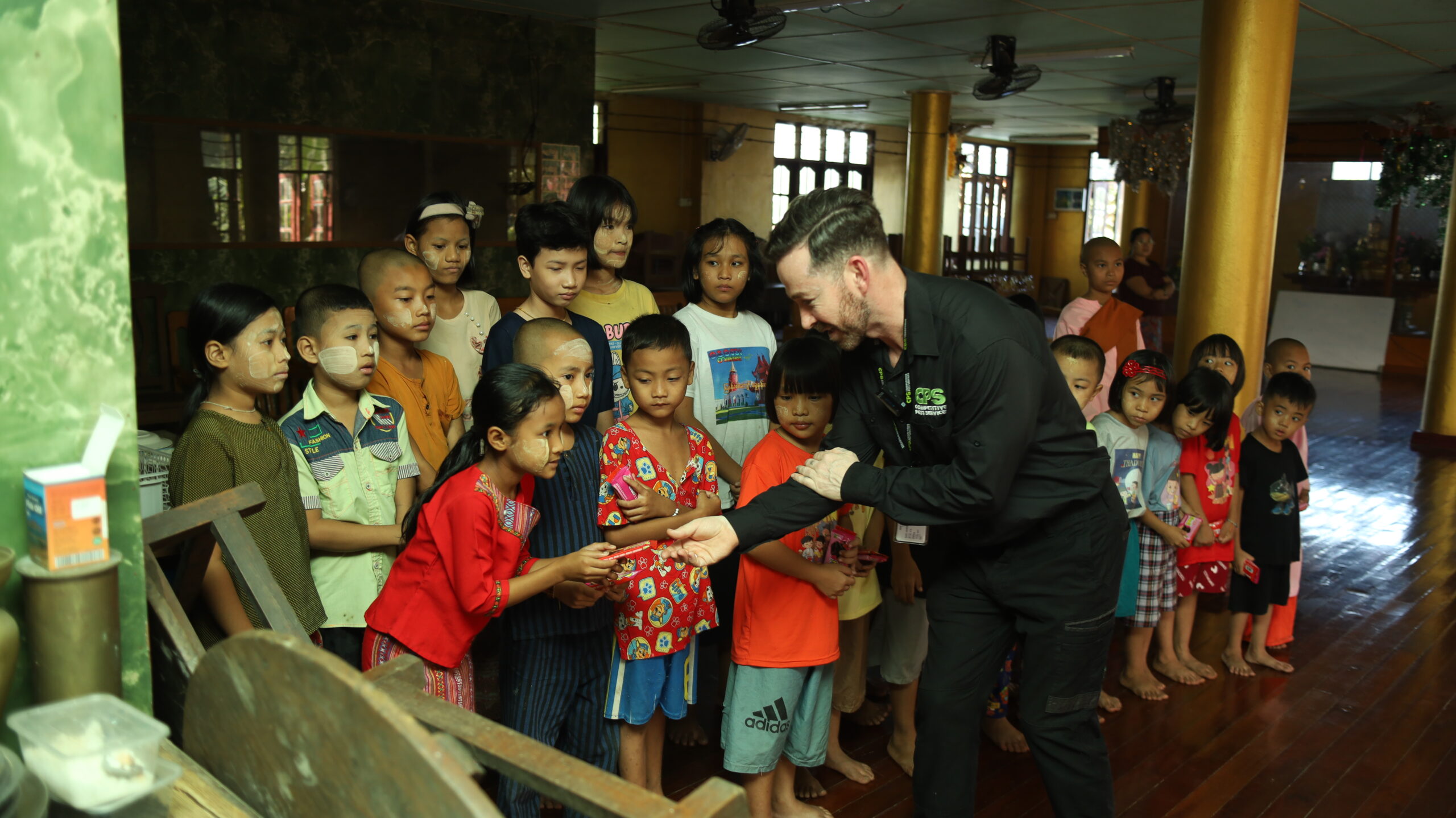 Gary Journeaux with children at Whitharkar orphanage
